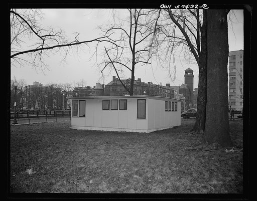 Houses for Britain. Side view of model prefabricated house erected by the Federal Public Housing Authority at Scott Circle, Washington, D.C. of the type of temporary, emergency family dwellings which it is planned to ship to Great Britain under lend-lease. Twenty-four feet square, it contains two be