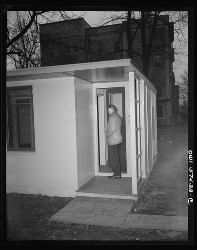 Houses for Britain. Detail of front entrance of model prefabricated house erected by the Federal Public Housing Authority at Scott Circle, Washington, D.C. of the type of temporary, emergency family dwellings which it is planned to ship to Great Britain under lend-lease. Small entrance hall provides