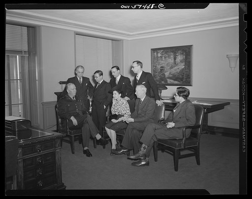 French journalists visit General George C. Marshall at his office in the Pentagon building. Left to right: (seated), General Marshall, Mme Etiennette Benichon, Louis Lombard, (standing) Francois Prieur, Jean-Paul Sartre, Stephane Pizella, and Pierre Denoyer
