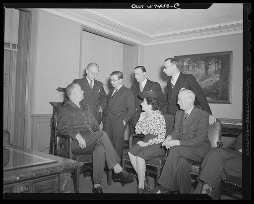 French journalists visit General George C. Marshall at his office in the Pentagon building. Left to right: (seated), General Marshall, Mme Etiennette Benichon, Louis Lombard, (standing) Francois Prieur, Jean-Paul Sartre, Stephane Pizella, and Pierre Denoyer