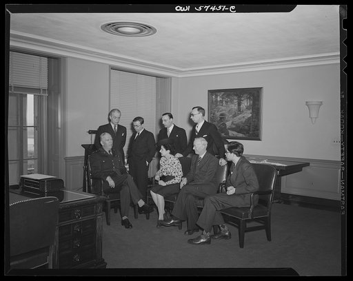 French journalists visit General George C. Marshall at his office in the Pentagon building. Left to right: (seated), General Marshall, Mme Etiennette Benichon, Louis Lombard, (standing) Francois Prieur, Jean-Paul Sartre, Stephane Pizella, and Pierre Denoyer