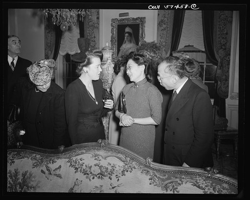 Mrs. James Clarke (wife of Office of War Information official and expert on the Balkans), Madame P.W.Kuo, Mr. Carson Chang at a reception celebrating International Women's Day at the home of Joseph E. Davies, former United States Ambassador to the Union of Soviet Socialist Republics