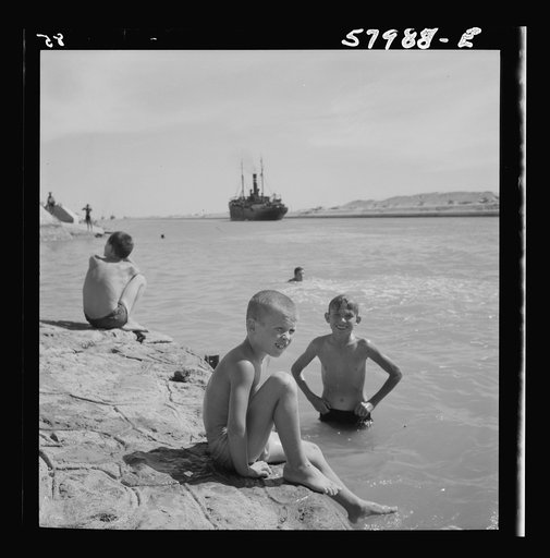 Children bathing in a river at El Shatt, the United Nations Relief and Rehabilitation Administration's refugee camp for Yugoslavs