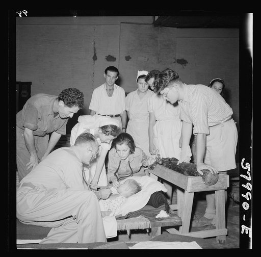 Child receiving medical attention at El Shatt, the United Nations Relief and Rehabilitation Administration's refugee camp for Yugoslavs