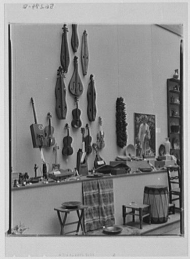 Rural arts exhibition held under the auspices of the Farm Security Administration (FSA) in the patio of the U.S. Department of Agriculture building. Musical instruments: dulcimers, fiddles, Viking cello, zitterns, hardanger, Paul Bunyan harp (from Southern Highlands and Wisconsin lumber camps). Some