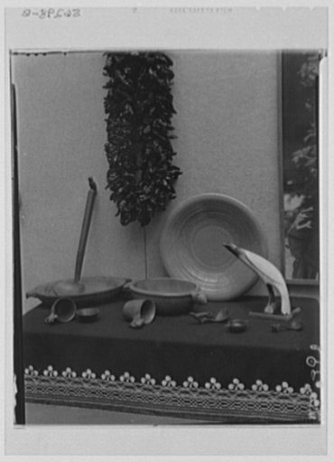 Rural arts exhibition held under the auspices of the Farm Security Administration (FSA) in the patio of the U.S. Department of Agriculture building. Peppers from New Mexico; wooden utensils from Five Nations of Indians, loaned by Rochester Museum, N.Y.; bird carved from cow's horn from Kansas; potte