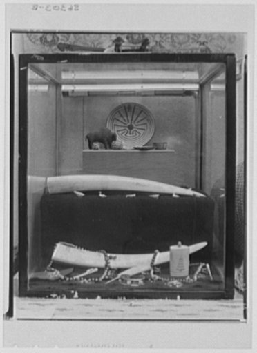 Rural arts exhibition held under the auspices of the Farm Security Administration (FSA) in the patio of the U.S. Department of Agriculture building. Ivory from Alaska; Indian jewelry; Indian baskets