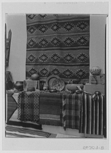 Rural arts exhibition held under the auspices of the Farm Security Administration (FSA) in the patio of the U.S. Department of Agriculture building. Weaving on wall by Churchill weavers, Berea, Kentucky; weavin on wall by Spinning Wheel, Asheville, North Carolina; copper plate from society of Connec