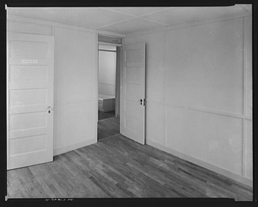 Houses for Britain. View from one of the two bedrooms throught small hall to bathroom, in model house erected by the Federal Public Housing Authority at Scott Circle, Washington, D.C of the type which it is planned to ship to Great Britain under lend-lease. Designed for maximum privacy, the two bedr