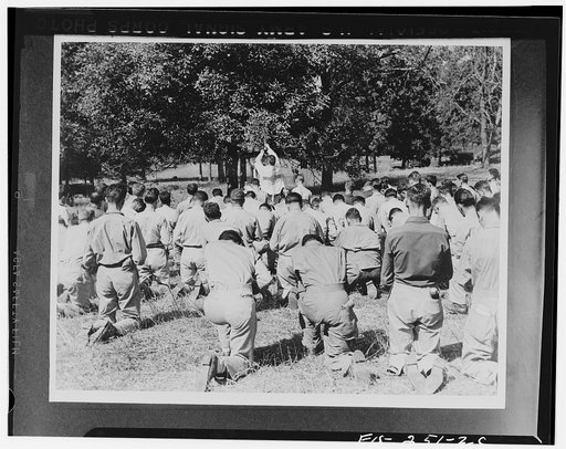 Officers and enlisted men gathered for Sunday worship somewhere in Tennessee at a field service during maneuvers