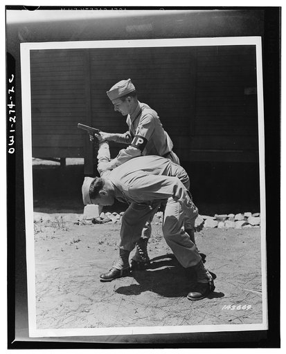 Fort McPherson, Georgia. Private Elliott Schneiderman and (MP) Military Police Private Edward Tevault practicing disarming a gunman
