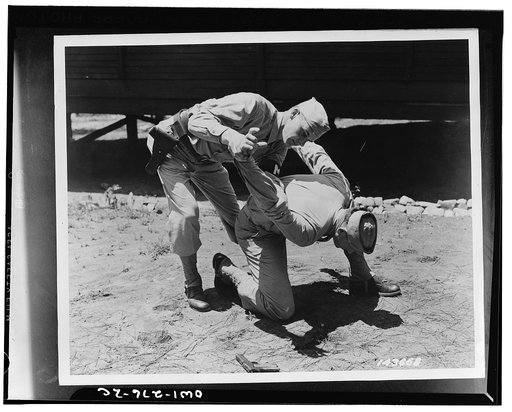 Fort McPherson, Georgia. Private Elliott Schneiderman and MP (Military Police) Private Edward Tevault practicing disarming a gunman