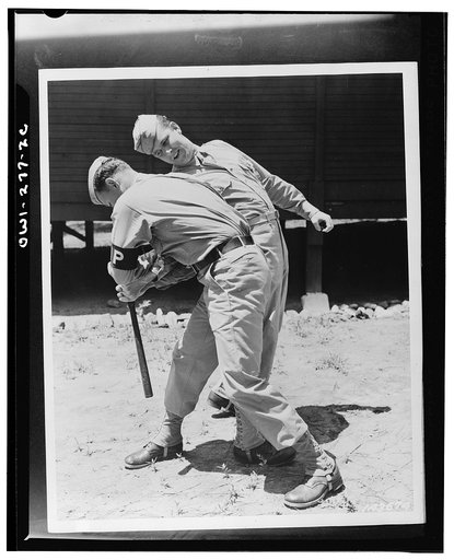 Fort McPherson, Georgia. Private Melvin Kearney and MP (Military Police) Private Elliott Schneiderman practicing disarming a club man