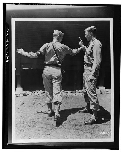 Fort McPherson, Georgia. Private Elliott Schneiderman and MP (Military Police) Private Edward Tevault practicing disarming a gunman