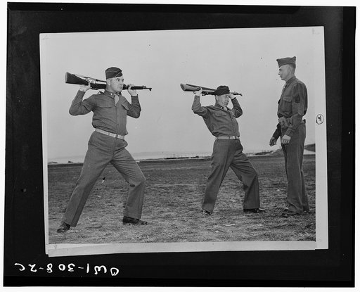 Fort Slocum, New York. James J. Braddock, former heavyweight champion of the world, and his manager, Joseph Gould, have joined the Atlantic Coast Transportation Corps Officers Training School, which opened recently. They have received commissions of first lieutenants. Lieutenant Braddock and Lieuten