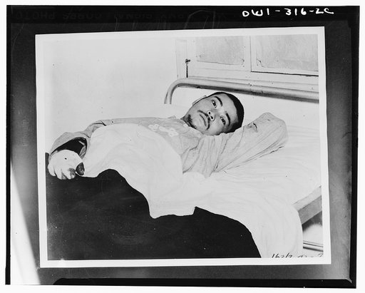 Japanese prisoner recuperating from his wounds in a clearing station in New Caledonia to which he was removed after being captured in the battle of the Solomons