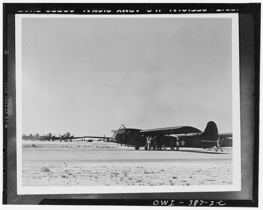 U.S. Airborne Infantry troops loading a transport glider which will be used in maneuvers in the southwestern United States