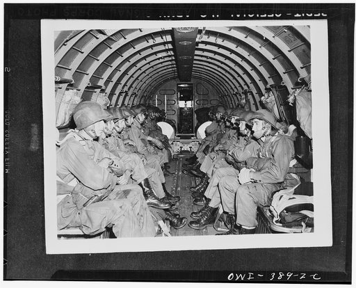 U.S. paratroopers awaiting orders to jump during manuevers somewhere in England