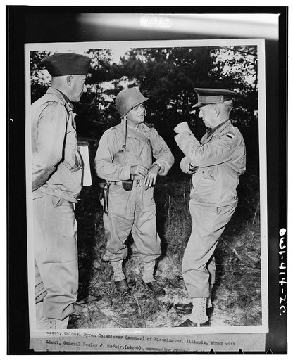 Lieutenant Colonel Byron Coleblazer (center) of Bloomington, Illinois, shown with Lieutenant General Lesley J. McNair (right), commanding general of the U.S. Army ground forces, discussing one of the problems worked out during the recent maneuvers of the Third Army in Louisiana. Colonel Coleblazer i