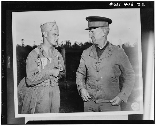 Lieutenant General Lesley J. McNair, right, commanding general of the U.S. Army ground forces, discussing with an umpire one of the problems being worked out at the recent maneuvers of the Third Army in Louisiana