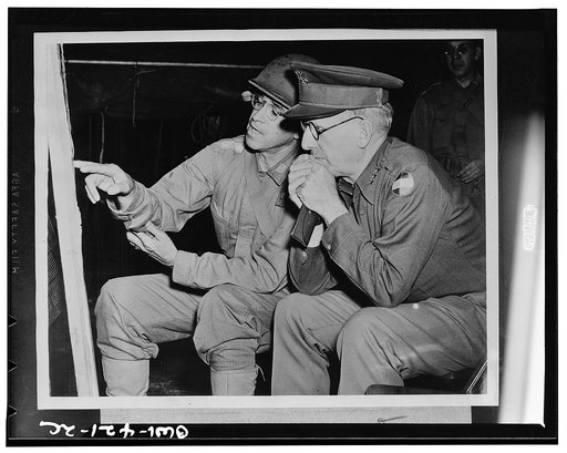 Major General Omar N. Bradley and Lieutenant General Lesley J. McNair during the recent maneuvers of the the Third Army in Louisiana. General Bradley is seen pointing out one ot the maneuver situations to General McNair