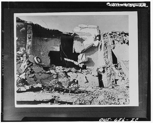 Tobruk, Libya. One hour after Tobruk fell, such scenes as this were common. Roofless buildings stand among scattered masonry and wreckage of motor vehicles in a corner of the bomb-torn town which had been one of the main supply ports for Rommel's army in North Africa