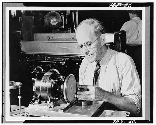 Dearborn, Michigan. Karl Axel Westerberg, foreman of the rough stock department in the Jogansson Gage Division at work at the Ford Motor Company plant