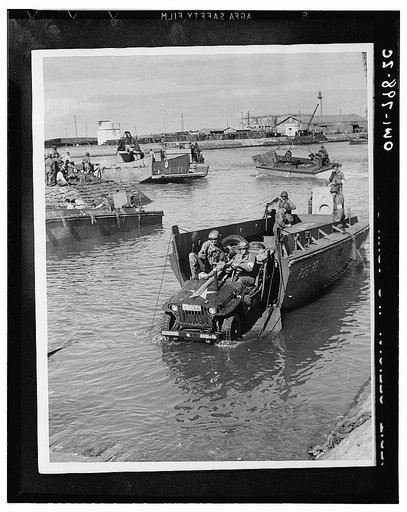 Fedala, Morocco. Jeep rolling off a landing boat at Fedala harbor during the landing operations of the U.S. task forces there