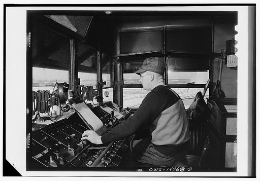 Chicago, Illinois. Retarder operator in his tower at the hump in the Chicago and Northwestern classification yard