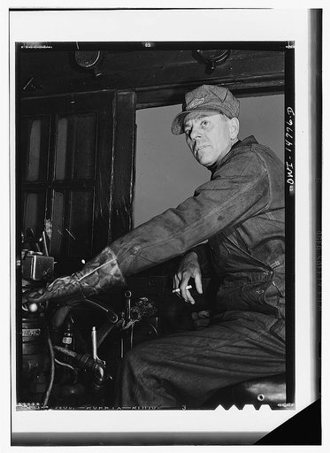 Chicago, Illinois. Mr. E. Larsen, engineer, in a Chicago and Northwestern Railroad yard