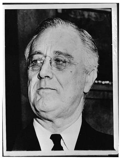 Washington, D.C. President Roosevelt on the steps of St John's Episcopal church after he had attended prayer services marking the ninth anniversary of this first inauguration.