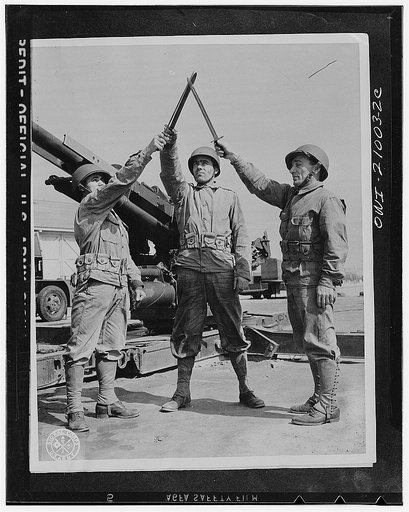 Camp Edwards, Massachusetts. Greek trainees with the Anti-aircraft artillery training center. Left to right: Private James Bezirgianidis, Thomas Harris (ne Hanozoes) and Damainos Daykos. Harris served with the Greek Navy before coming to this country while Deykos saw service with the Greek Army