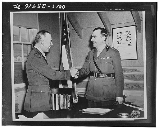 Camp Carson, Colorado. Colonel Wilfrid M. Nlunt, the commanding officer shakes hands with Colonel Denetrius Xenos, military attache of the Greek ambassador to the United States