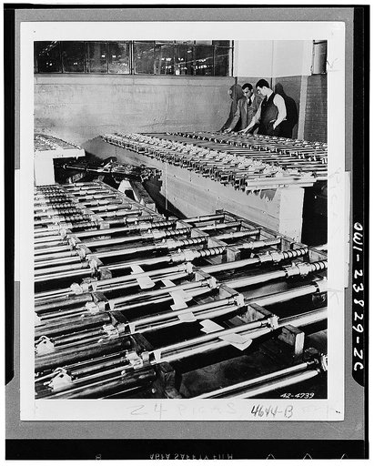 Completed guns for planes await shipment from one of the Oldsmobile's gun plants