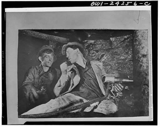 Alexei Stakhanov explaining his system to a fellow miner in the USSR (Union of Soviet Socialist Republics)