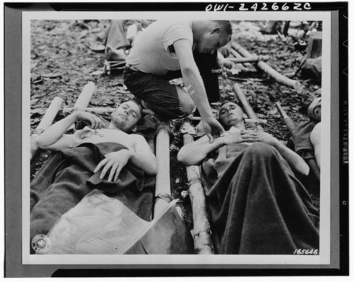 Medical officer, Captain John Branson, of Concord, New Hampshire, giving attention to wounded American soldiers