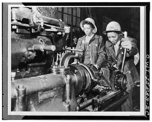 Martha Bryant and Eulalie Hampden operating a bolt cutting machine