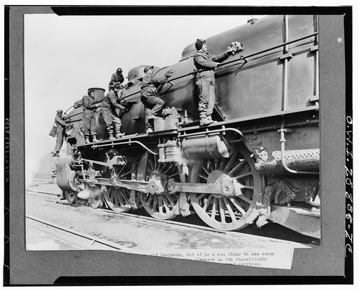 Washing locomotives is an old business, but it is a new thing to see women doing the work. This crew of women engine cleaners on the Pennsylvania Railroad is taking the place of men called into the armed services