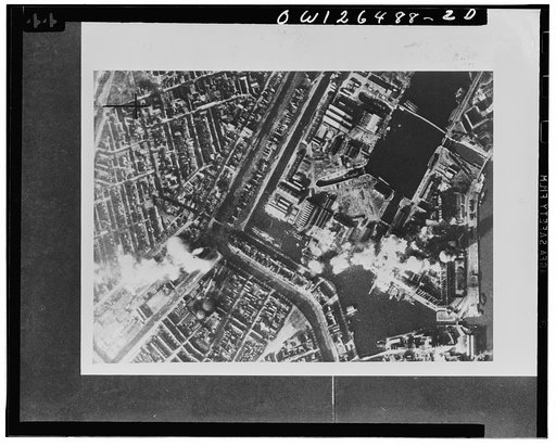 Royal Air Force "Ventura" bombers blast Ijuiden steelworks by day. "Ventura" aircraft of the Royal Air Force Bomber Command, escorted by fighters, carried out a daylight attack on the Royal Dutch blast furnaces and steelworks at Ijumuiden, Holland, on February 13, 1943. Action photo taken during the
