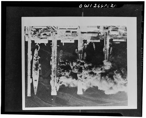 The scuttled French fleet at Toulon: aerial pictures. On November 28, 1942, the day after the scuttling and firing of the ships of the French fleet in Toulon harbor, photographs were taken by the Royal Air Force. Many of the vessels were still burning so that smoke and shadows obscure part of the sc