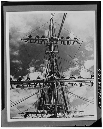 Apprentice seamen in the United States Maritime Service manning the yards on the square-rigged training ship "Joseph Conrad"