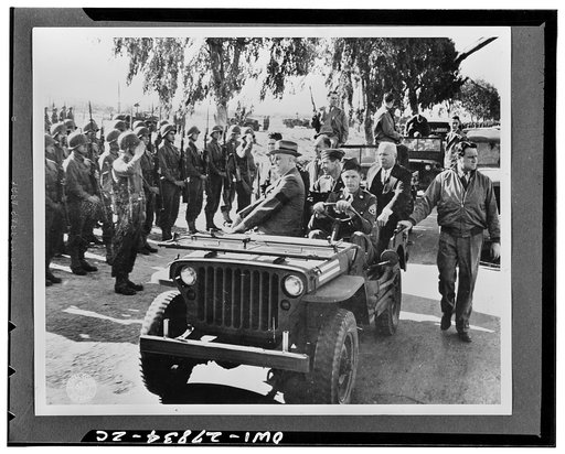 Casablanca, Morocco. President Franklin D. Roosevelt reviewing American troops. Staff Sergeant Oran Lass of Kansas City, Missouri, is driving the jeep
