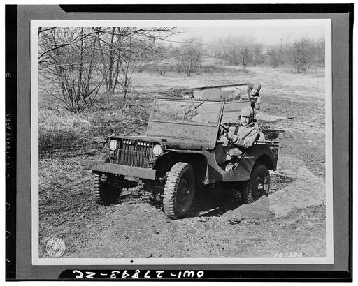 Baltimore, Maryland. Colonel H.J. Lawes, post commander, Holabird quartermaster depot and commandant of the quartermaster motor transport school at the wheel of a "jeep" giving his pupils first-hand instructions on the vehicle training ground during a two-week preventive maintenance for motor vehicl