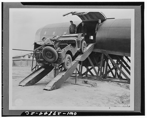 Fort Benning, Georgia. Men in the Airborne Infantry receiving preliminary training in an especially built fuselage called a "mockup," an exact replica of the planes in which they will receive the advance training. They are driving a jeep into the plane