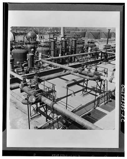 Storage. Grain alcohol is pumped from tank cars to storage tanks (shown in the background at the right) at the Institute plant at Institute, West Virginia. Operated by the Union Carbide and Carbon Corporation