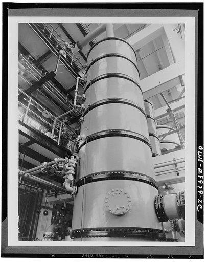 Distilling. Distillation tanks where butatiene is purified at the Institute plant at Institute, West Virginia