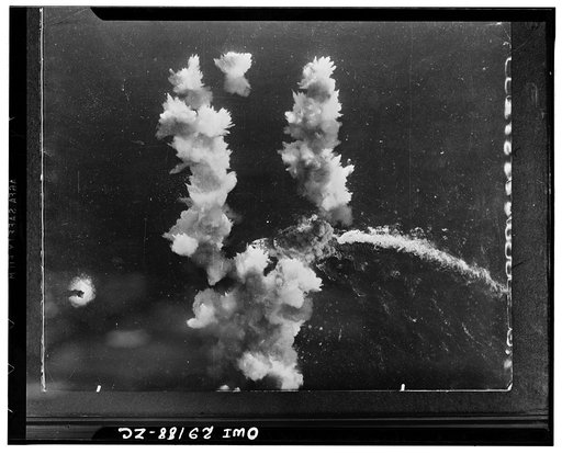 A Flying Fortress of the Northwest African strategic Air force scoring a direct hit in a 400-foot Italian liner which had been converted into a troop carrier. The action took place in the Mediterranean sea