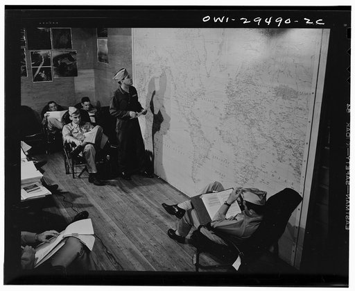 Pilots of the United States Army air transport command studying a map