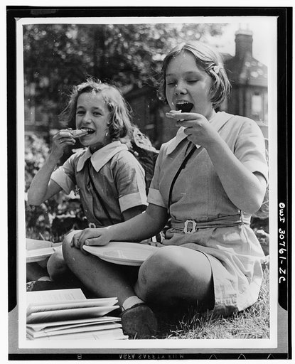 British children somewhere in England, eating cheese
