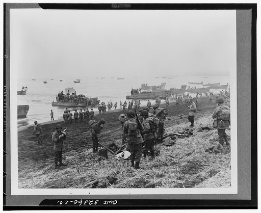 Attu, Aleutian Islands. Landing boats pouring soldiers and their equipment onto the beach at Massacre Bay. This is the Southern landing force